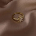 Macro shot of gold adjustable ring featuring a square zircon with a four-prong setting - Square Micro-Inlaid Style (16345)