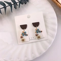 Macro shot of handmade floral earrings with 3D yellow flowers on a white base detail - Branch Berry Style (B 树杈)