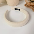 Detail of handmade cream sponge headband showing thick twill cotton texture and woven label - White