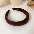 Detailed shot of a thick brown sponge headband with a handmade label inside - Dark Coffee
