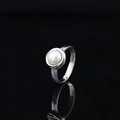 Minimalist silver-tone ring featuring a round white pearl with high-polish finish - US 6 / Steel Color White Gem