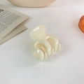 Dettaglio del fermaglio per capelli color crema opaco con design a polipo - Lucido / Beige Lucido