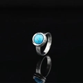 Minimalist silver ring featuring a round blue turquoise gemstone on a sleek black background - US 6 / Silver Tone Turquoise