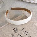 Close-up of cream leather headband showing the fine texture and brown non-slip lining - Simple Leather Look Style (18153B)