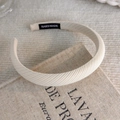 Detail of handmade wide cream headband with textured fabric on rustic linen background - Wide Fabric Style (21750)