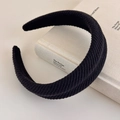 Detail showing thick black corduroy headband texture on a white book minimalist setting - Deep Black Corduroy Vintage (27502F)