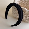 Close-up of black wide-brimmed padded headband with elegant matte suede texture - Black Suede-Look Thick Padded (27418F)