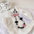 Pink and black heart beaded phone charm chain in an elegant white ceramic floral dish - Pink & Black Heart (Main Style)