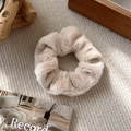 Detail of soft cream faux fur scrunchie showing plush texture on knitted fabric - C Beige
