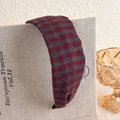 Close-up of vintage red and grey plaid plush headband on a decorative book - Red Black Woolen Plaid Style (13# 27632A)