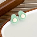 Close-up of cute flocked avocado stud earrings with soft velvet texture on a ceramic dish - Avocado (B)