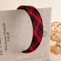 Close-up of red and black tartan padded headband on vintage books with natural lighting - Red Black Classic Plaid Fabric Padded Style (25# 27321A)