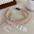Detailed view of brown striped headband featuring handmade label and textured fabric - Butterscotch