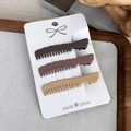 Detailed view of three matte brown wavy hair clips displayed on a white card - Comb Style (24552A)