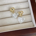 Detail of vintage heart glass earrings with gold rose pins in a jewelry box - Gold (Main Image)