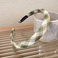 Detail of green plaid headband with handmade label on white ceramic cup background - Thin Green White Plaid