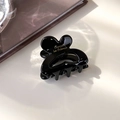 Detalle de pinza para el pelo en resina negra con logo dorado Barrette la France al sol - Negro Charol