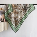 Detail of elegant butterfly and floral print on beige square scarf with green borders - 90x90cm / Green