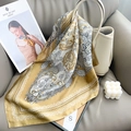 Classic paisley pattern silk scarf in gold and black tied on a stylish leather handbag - 65x65cm / Yellow