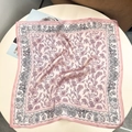 Pink and purple mulberry silk square scarf with paisley floral pattern on a table - 53x53 / Soft Pink Floral
