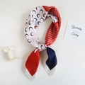 Detailed shot of a luxury silk-feel scarf with crescent moon patterns and tri-color patchwork - Standard Spec / Red Crescent Moon Style (70FJ337-1)