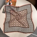 Pink and brown floral silk scarf with geometric patterns laid on a white table - 53x53 / Pink Gingham