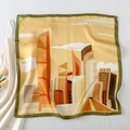 Detailed view of square silk scarf featuring warm urban architecture illustration prints - Autumn City Scene