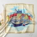 Close-up of square satin scarf featuring Nordic harbor architecture and sailboat prints - Norway Water City