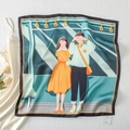 Detail of satin square scarf featuring a colorful couple illustration with hand-rolled edges - First Love Song