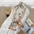 Detail of floral silk scarf with elegant pearl accents and vibrant orange borders - 17*150cm / Little Floral