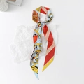 Detailed view of floral twilly scarf with blue and yellow cartoon illustrations on satin - Sketch Urban - Yellow