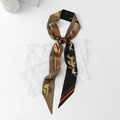 Detailed macro of a silk skinny scarf featuring equestrian horse and rider patterns - Racing Equestrian - Black