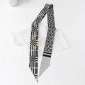 Macro detail of silky twilly scarf with checkerboard and vintage horsebit patterns - Geometric - Gray
