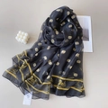 Detail of luxury black silk scarf with golden carriage patterns and letter emblems - Black Gold Carriage Monogram Style (YRS188-2)