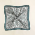 Detailed macro view of paisley silk-feel square scarf with gold trim and emerald green borders - White Blue Green (70FJ307-1)
