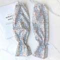 Floral chiffon cooling arm sleeves in light blue with floral pattern and ruffle cuffs - Edelweiss