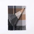 Detail of plaid scarf featuring brown and grey grid pattern with soft fringe edges - Grey Brown