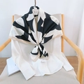 Elegant black and white camellia silk scarf with gold border on a white chair - Black / 90*90cm
