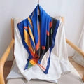 Fashionable twill silk scarf with blue and orange geometric prints draped on a white shirt - 90cmx90cm / Blue