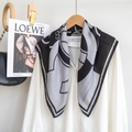 Floral and geometric print silk scarf displayed on a hanger with a classic white shirt - 68x68cm / Grey & Black