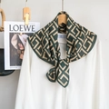 Detailed view of dark green geometric printed silk scarf tied on a white shirt collar - RZW027-2 / Green