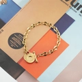 Bracciale a catena in titanio dorato con chiusura a levetta OT e doppi ciondoli tondi - Oro