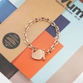 Elegante bracciale in acciaio al titanio oro rosa con ciondolo a cuore e chiusura a T - Oro rosa