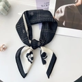Close-up of black and white silk scarf with floral patterns and pearl ring detail - 68x68cm / Black
