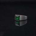 Matte black stainless steel ring with emerald green square zircon on a reflective surface - US 7 / Emerald Green