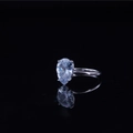 Elegant pear cut cubic zirconia solitaire ring with silver band on a black background - US 5 / Teardrop