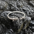 Mens vintage stainless steel dragon head cable cuff bracelet on dark stone background - Steel Color