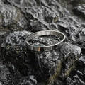 Minimalist silver oval titanium steel bangle with a polished finish and hinge clasp - Shiny Steel Tone (Small)