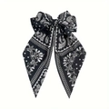 Detail of a vintage black paisley bow hair clip with long flowing chiffon streamers - Spring Clip Style / Black