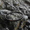 Minimalist black stainless steel bangle on rock background for men and women - Bright Small Style / Black